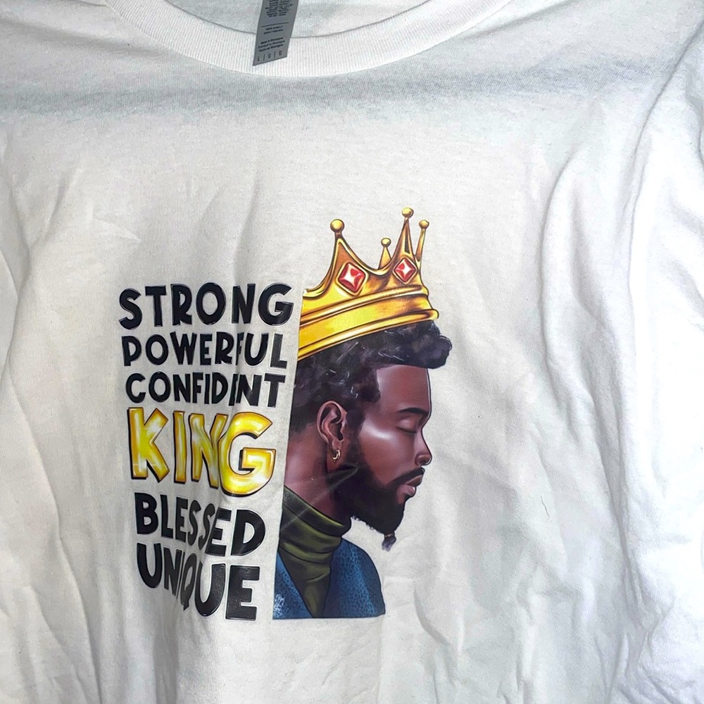 A large, white, black male affirmation t-shirt.